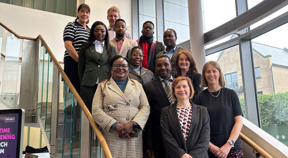 Picture of international delegates and SERC staff in the SERC SPACE. building